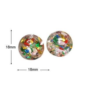 Detail view of 18mm round resin charms with colorful glitter and sequins for DIY jewelry