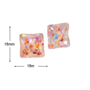 Detailed close-up of 18mm square resin earrings with colorful confetti sequins inside