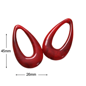 Macro view of 45x26mm red marble resin teardrop charms for jewelry making
