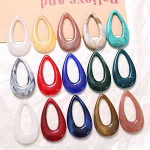 Detailed flat lay of teardrop-shaped hollow resin pendants for DIY jewelry making