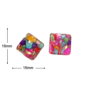 Detail view of 16mm square resin earrings with colorful irregular stone inclusions