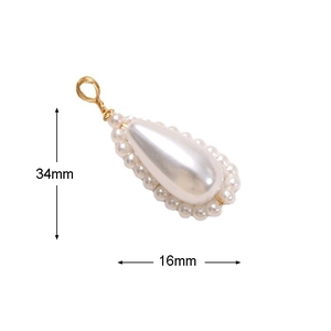 Detail view of water drop pearl pendant with gold wire wrap and 34mm by 16mm dimensions