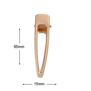 Detailed view of a 65mm golden geometric metal hair clip with precise dimensions