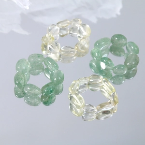Elastic natural gemstone rings featuring green aventurine and yellow crystal beads