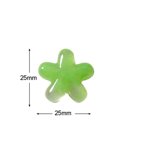 Macro shot of a 25mm green resin flower with marble texture for DIY jewelry making
