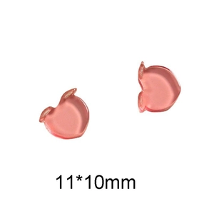 Vista macro de amuletos de resina rosa de 11x10mm para manicura y artesanía DIY