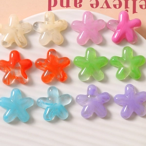 Macro detail of colorful resin flower beads with marble texture for DIY jewelry making