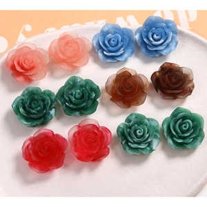 Detail view of 22mm resin rose flower charms for DIY jewelry and hair accessories
