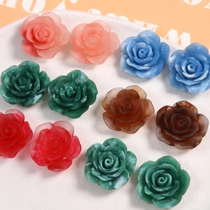 Macro shot of colorful resin 3D rose charms with marble texture for DIY jewelry crafts