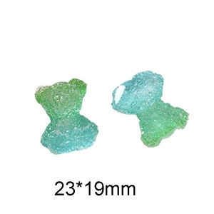 Detail view of a 23x19mm bear resin accessory with green-blue gradient and matte texture
