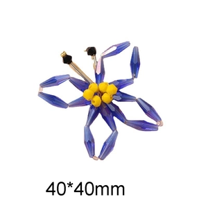 Detail view of woven butterfly bead charm in blue and yellow showing 40x40mm dimensions