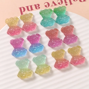 Detailed view of colorful gradient gummy bear resin charms with sugar-like texture