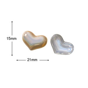 Macro detail of pearlescent heart charms showing 15x21mm dimensions and aurora luster