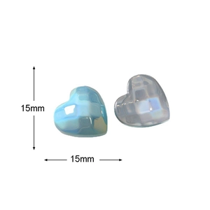 Macro shot of 15mm heart-shaped accessories with blue and white checkered pearl finish