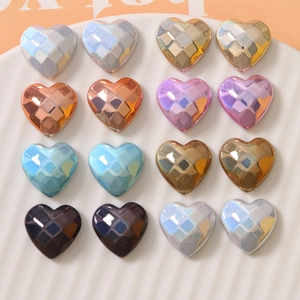 Macro view of geometric multi-faceted heart-shaped pearl resin beads for DIY jewelry