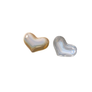 Iridescent heart-shaped pearl charms in amber and ice blue for DIY jewelry making
