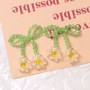 Handmade acrylic bead jewelry featuring green bow and transparent flower charms for DIY crafts