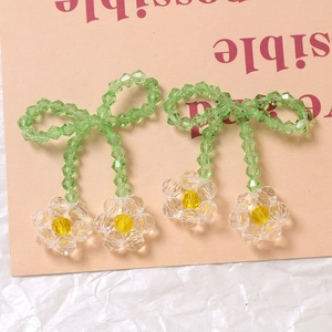 Handmade beaded flower and green bow charms with faceted crystals for DIY jewelry making