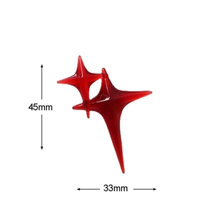 Translucent red resin four-pointed star charm with size measurements 45mm by 33mm