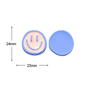 Detailed size view of pink and blue resin smiley face charms, 24mm by 23mm for DIY crafts