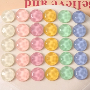 Close-up of 16mm round resin cabochons with water ripple texture in 6 pastel colors