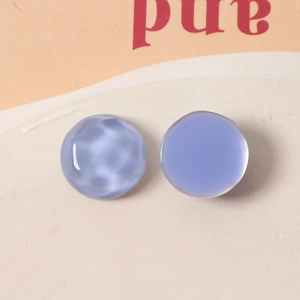 Detail showing 16mm lavender resin charms with water ripple texture and matte finish
