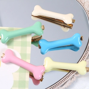 Cute glossy resin bone-shaped hair clips in five pastel colors with metal duckbill clips