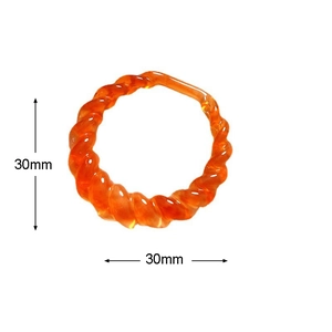Macro view showing dimensions of 30mm for the amber resin spiral geometric hoop accessory
