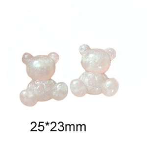 Macro detail of cute resin bear charms with pink glitter finish and 25x23mm size dimensions