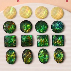 Close-up of faceted iridescent resin cabochons for DIY jewelry and hair clips