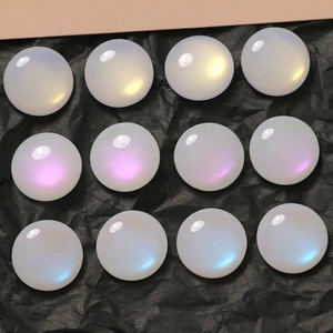 Detailed view of 16mm iridescent faux opal cabochons in a 4x3 grid on black background