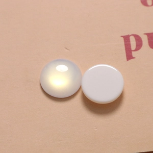 Detail of 16mm round iridescent cat-eye flatback charms for DIY jewelry and hair clips