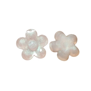 Pink glitter resin flower charms for DIY jewelry and hair accessories on white background