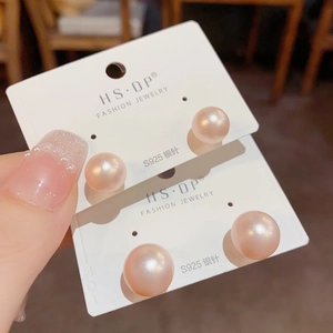 Elegant S925 silver needle pink pearl stud earrings in two sizes on jewelry card