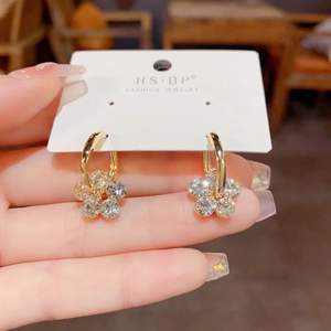 Elegant gold flower hoop earrings with crystal petals and pearl accents for women