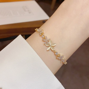 Elegant gold flower bracelet with cat eye stone and zircon crystals for women