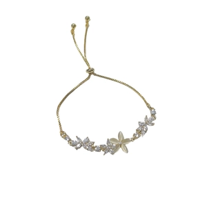 Adjustable gold bracelet with zircon flower clusters and cat eye stone center flower