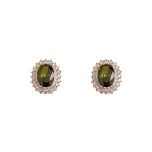Boucles d'oreilles de luxe avec émeraude de synthèse dorées et serti halo