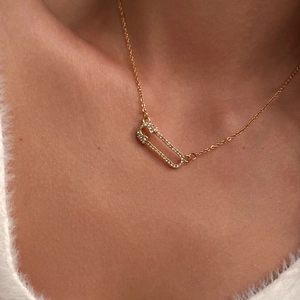 Detail of 18k gold plated paperclip pendant necklace with sparkling micro-pave zircons