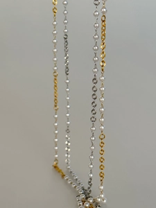Detail of 18k gold plated vintage pearl body chain with embossed metal links