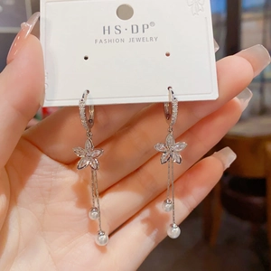 Fashionable floral tassel earrings with cubic zirconia and pearls on display card