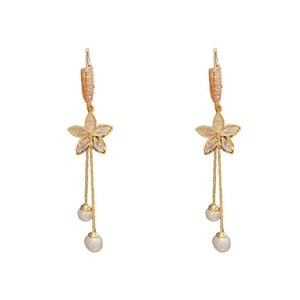 Elegant gold flower earrings with zircon pavé and long pearl tassels on white background