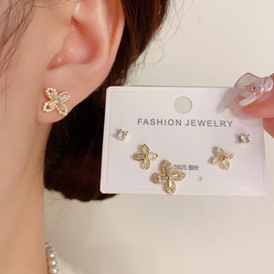 Detail of clover and butterfly earring set with micro-pave crystals and S925 silver needles