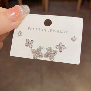Macro shot of 6-piece S925 silver stud earrings set with micro-paved clover designs