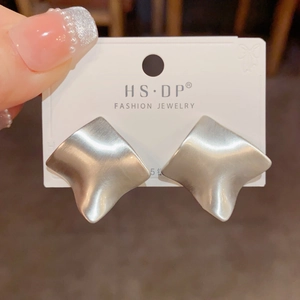 Detail of matte silver brushed geometric wave earrings with S925 silver needles