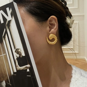 Golden spiral texture hoop earrings with polished French croissant design in retro style