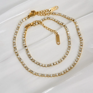 Elegante gouden titanium stalen armband set met parels en zirkoon op witte zijde