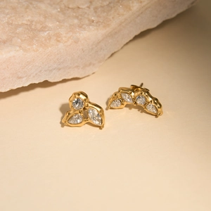 Macro view of 18K gold plated stud earrings with sparkling cubic zirconia clusters