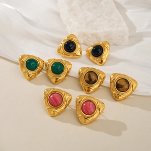 Detail of vintage 18k gold plated triangle earrings set with natural stone inlays