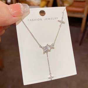 Sparkling starburst tassel pendant necklace with silver finish and micro-set zircon stones